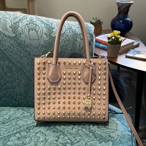 Light pink small Michael Kors bag with strap and keychain